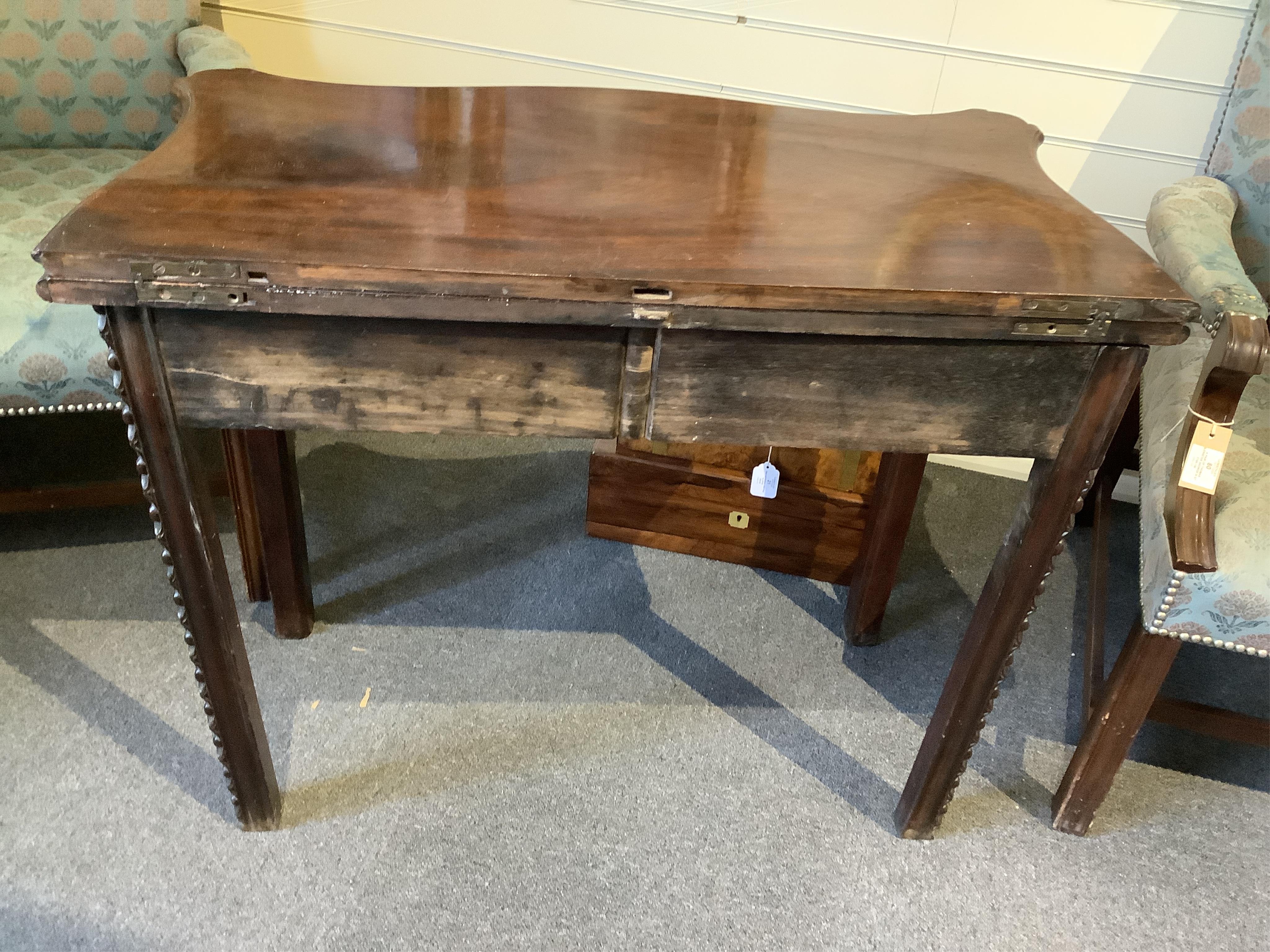 A George III serpentine mahogany tea table